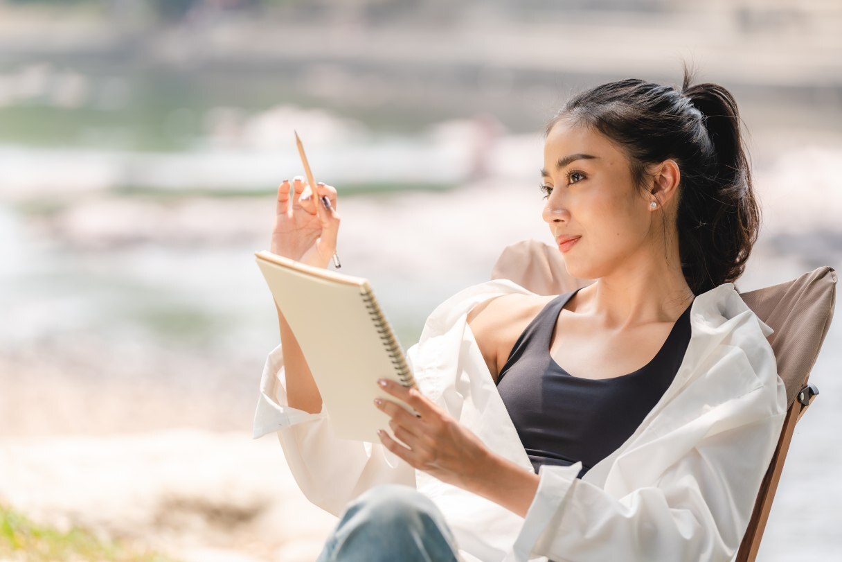 Woman writing in notebook