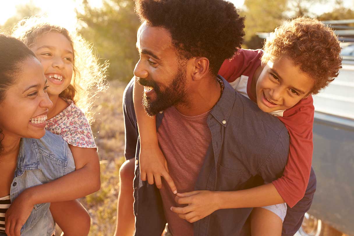 Smiling man with woman and child