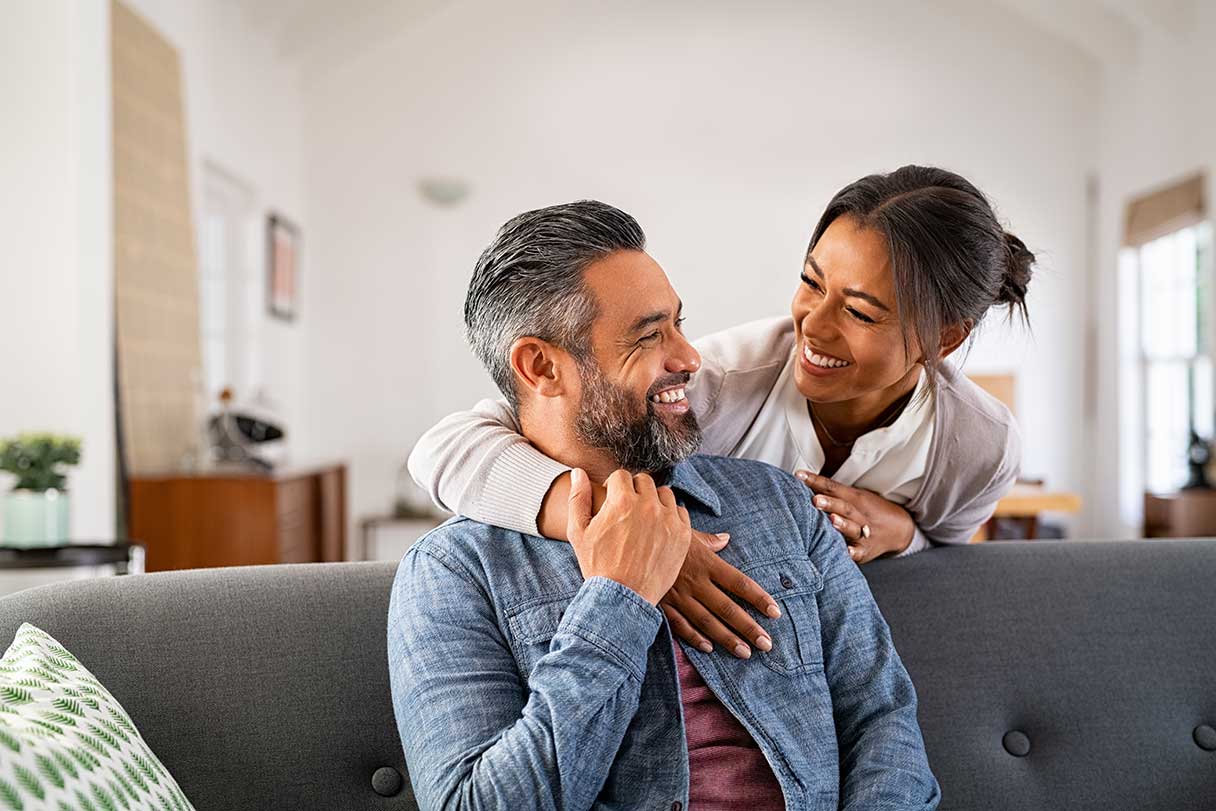 Man and woman smiling at each other