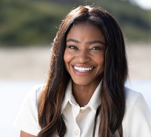 Woman in white shirt smiling