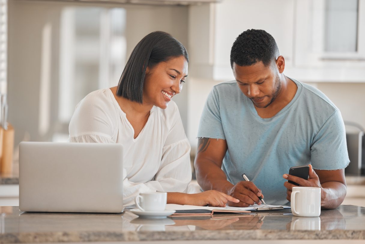 Man and woman working at a laptop