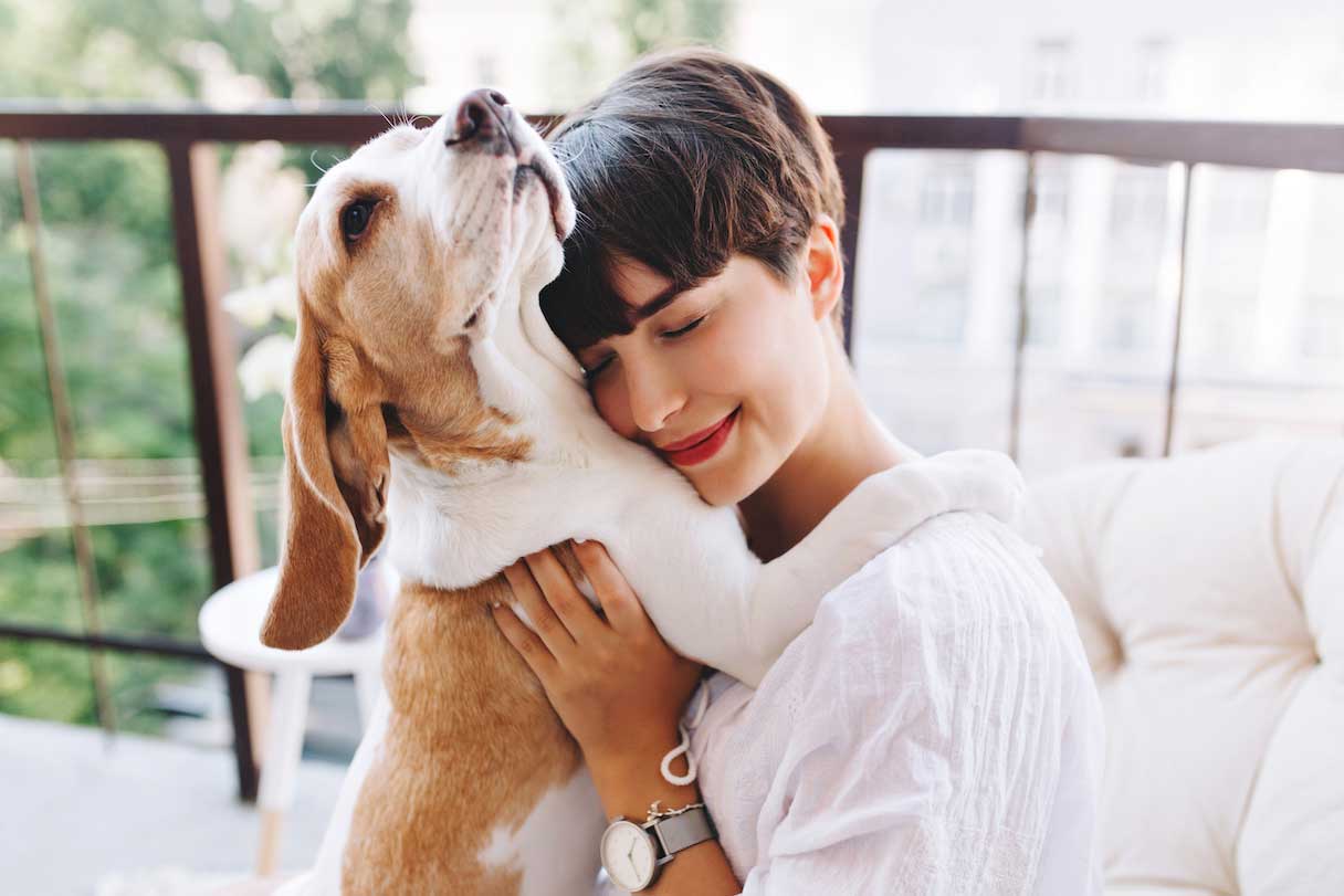 Woman hugging dog