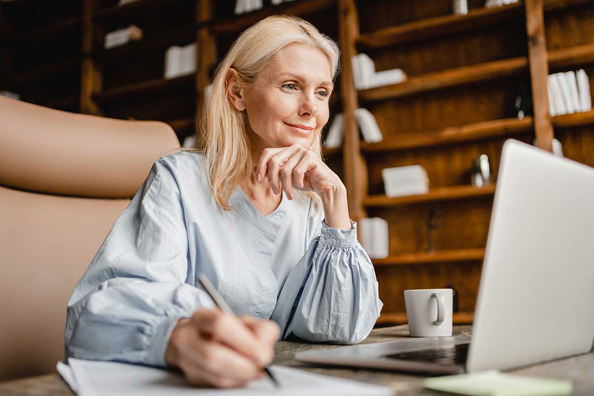 Senior woman looking at laptop