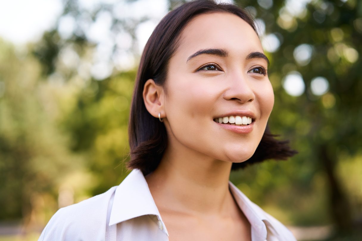 Close-up of woman outside, smiling