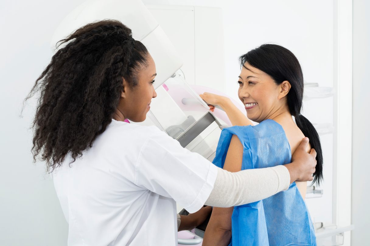 Woman receiving mammogram