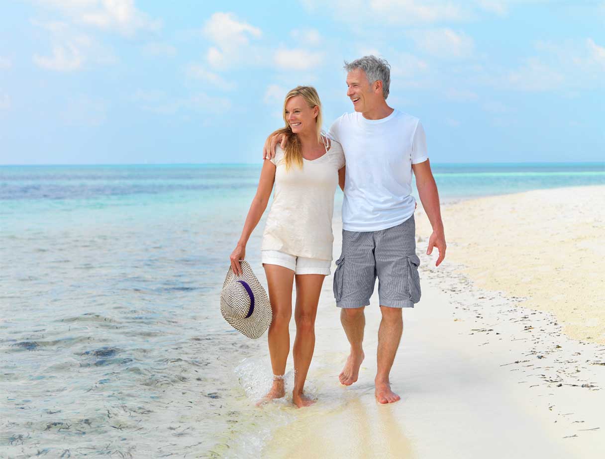 Couple outside, walking on a beach