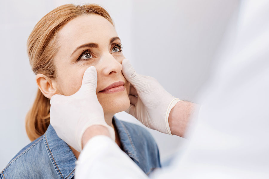 Woman receiving a plastic surgery consultation