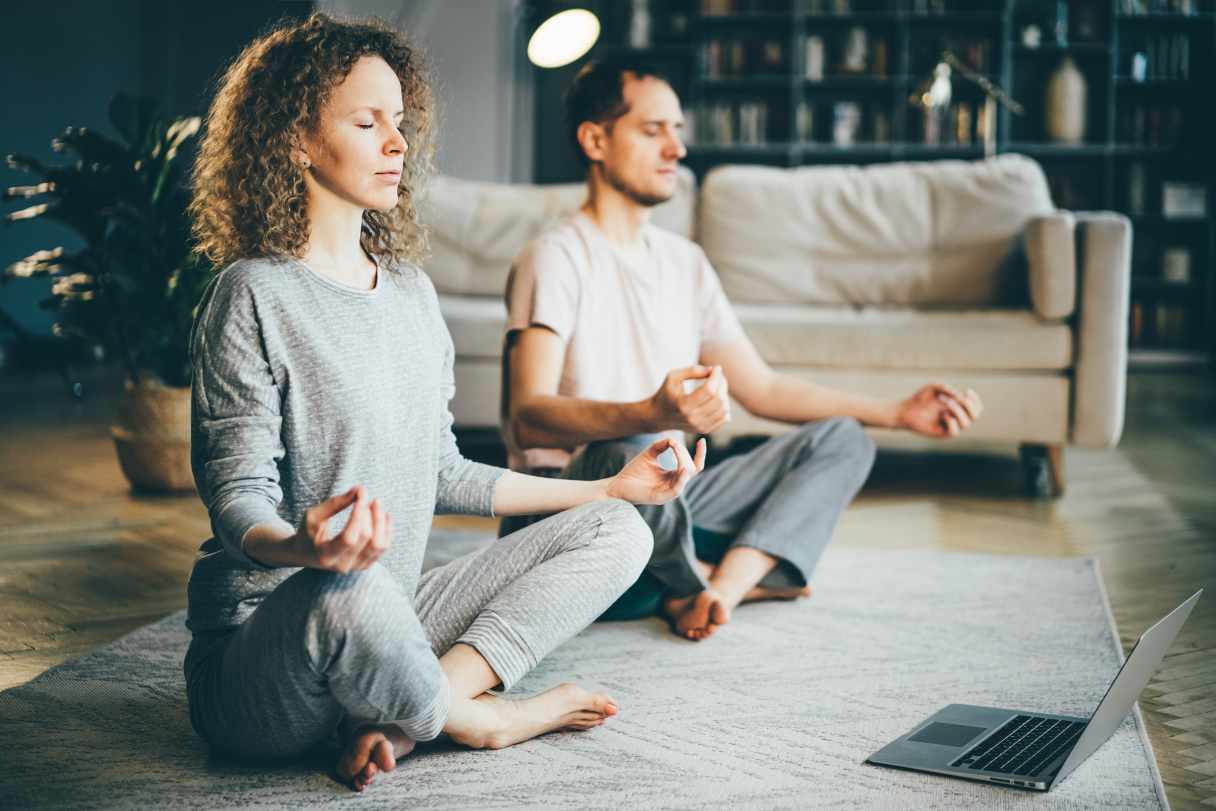 Man and woman meditating