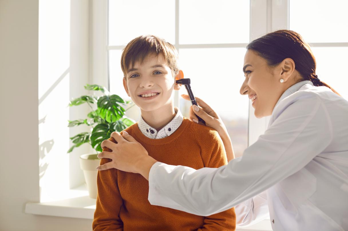 Young boy receiving ear exam