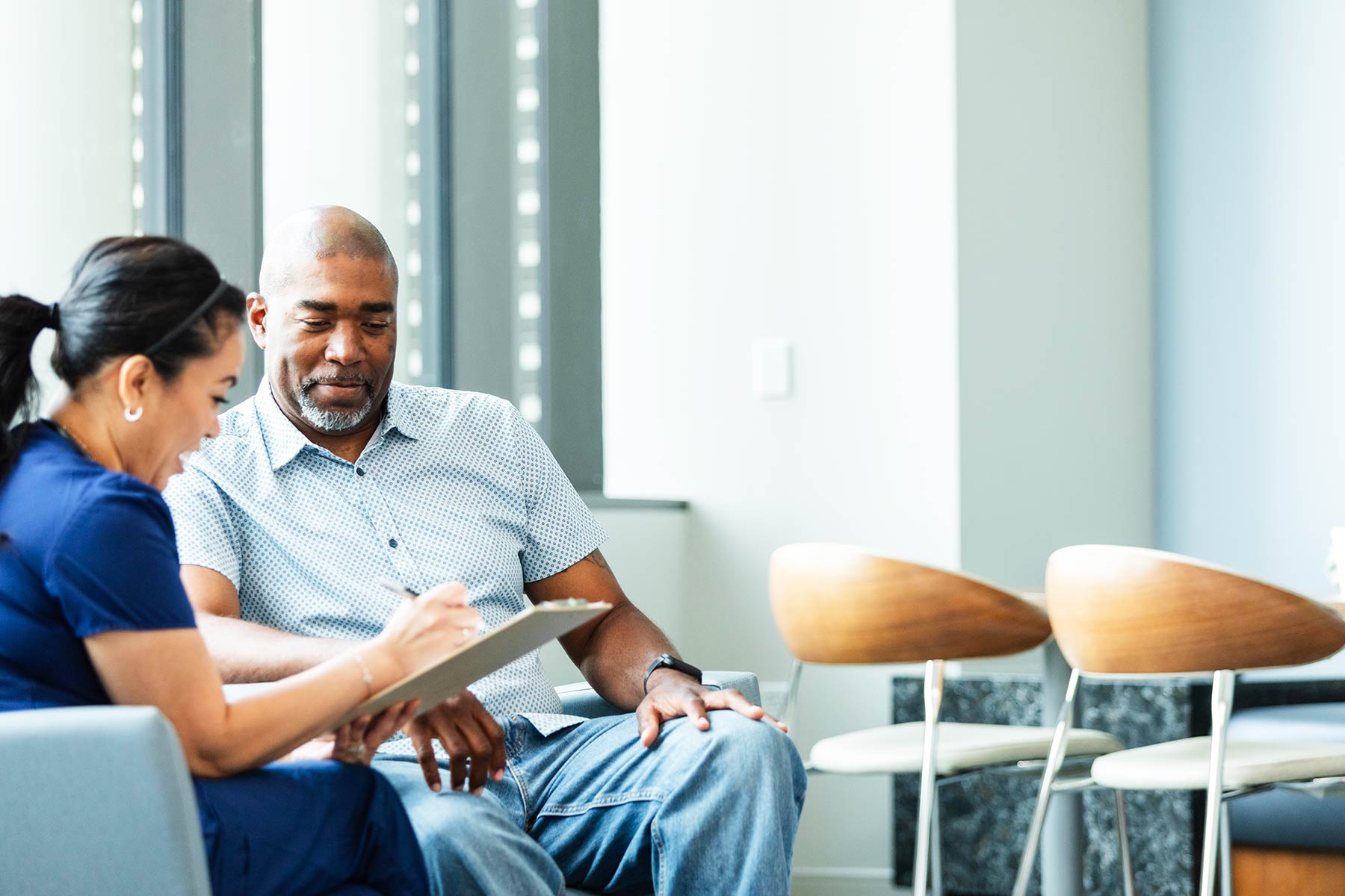 Provider showing patient a tablet screen