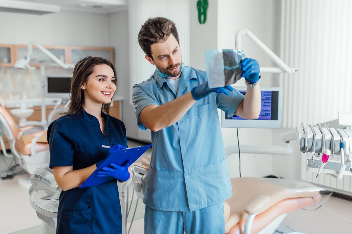 Dentist showing hygienist an x-ray