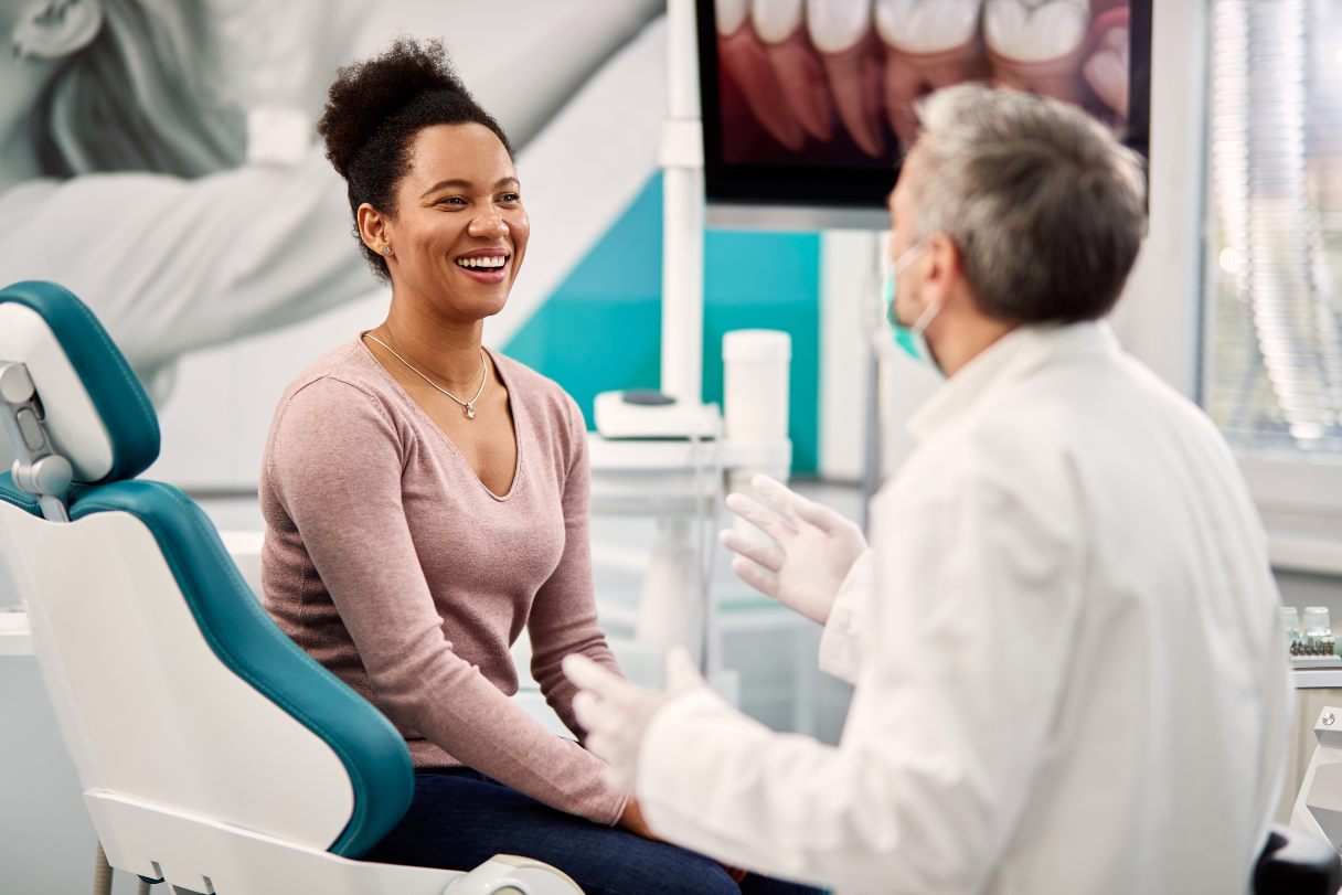 Woman speaking with dentist