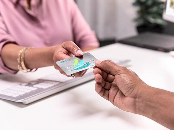 Health system staff helping patient with CareCredit financing