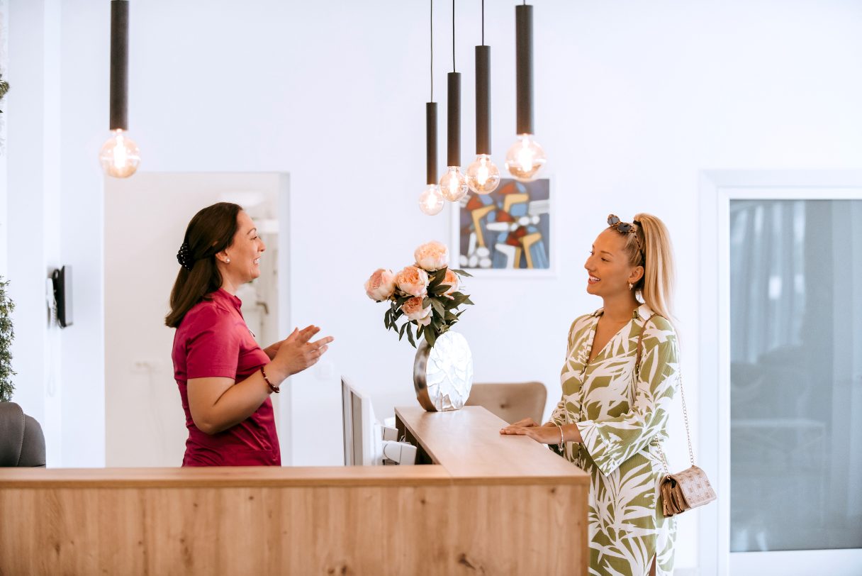 Med spa receptionist speaking with client