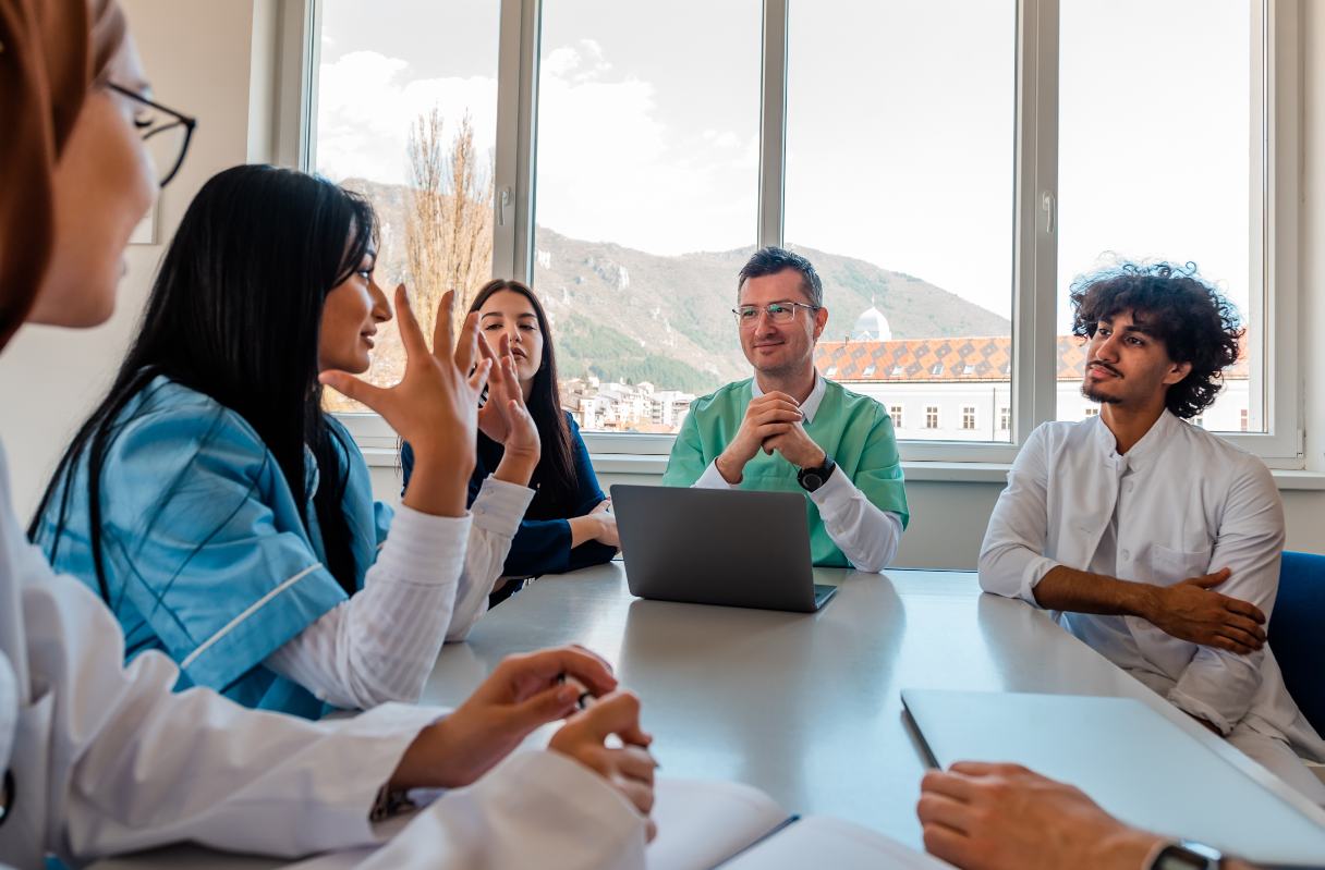 Dental professionals sitting at a conference table