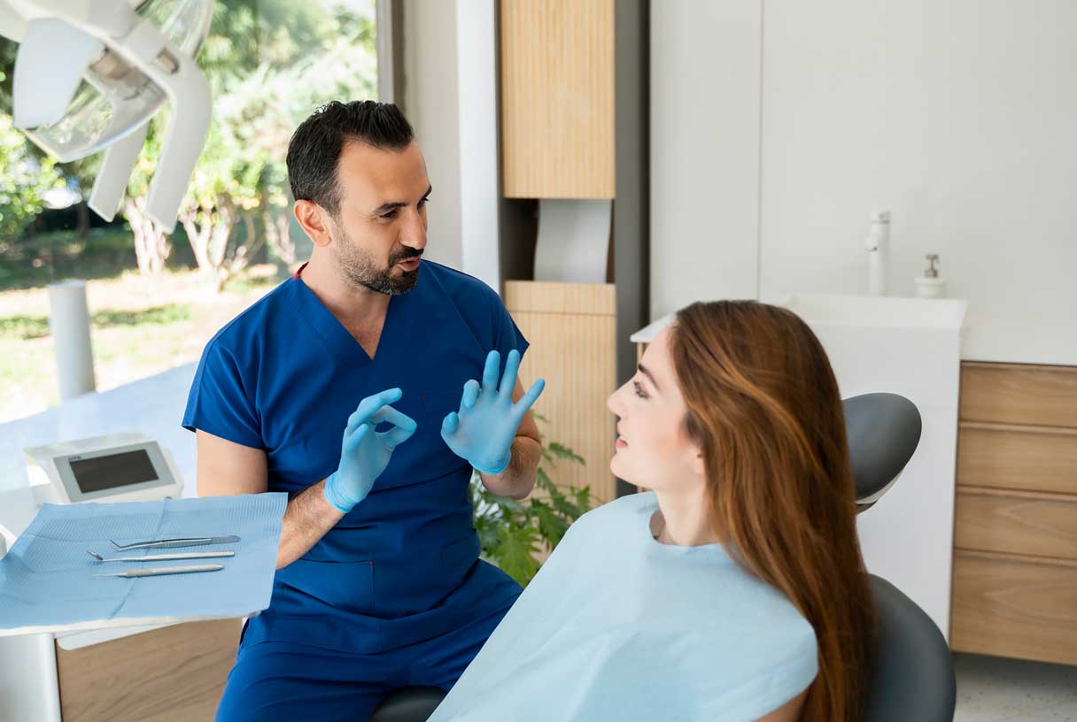 Dentist speaking to patient