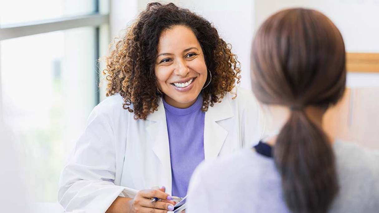 Doctor speaking with patient