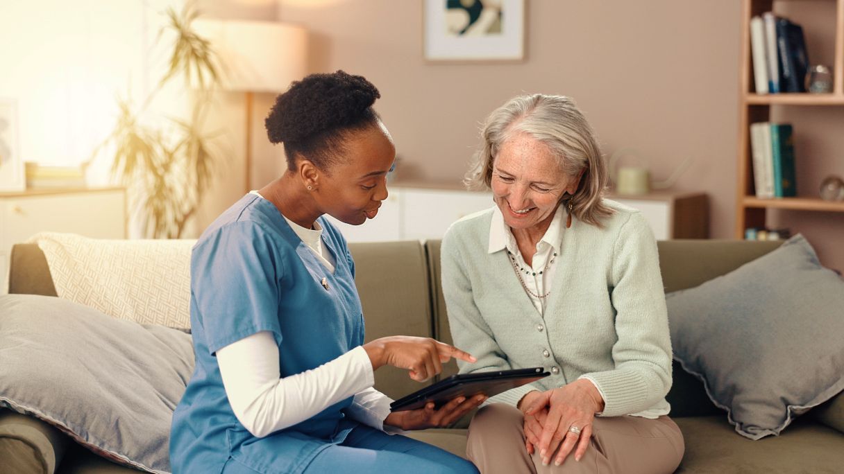 Healthcare professional speaking with woman