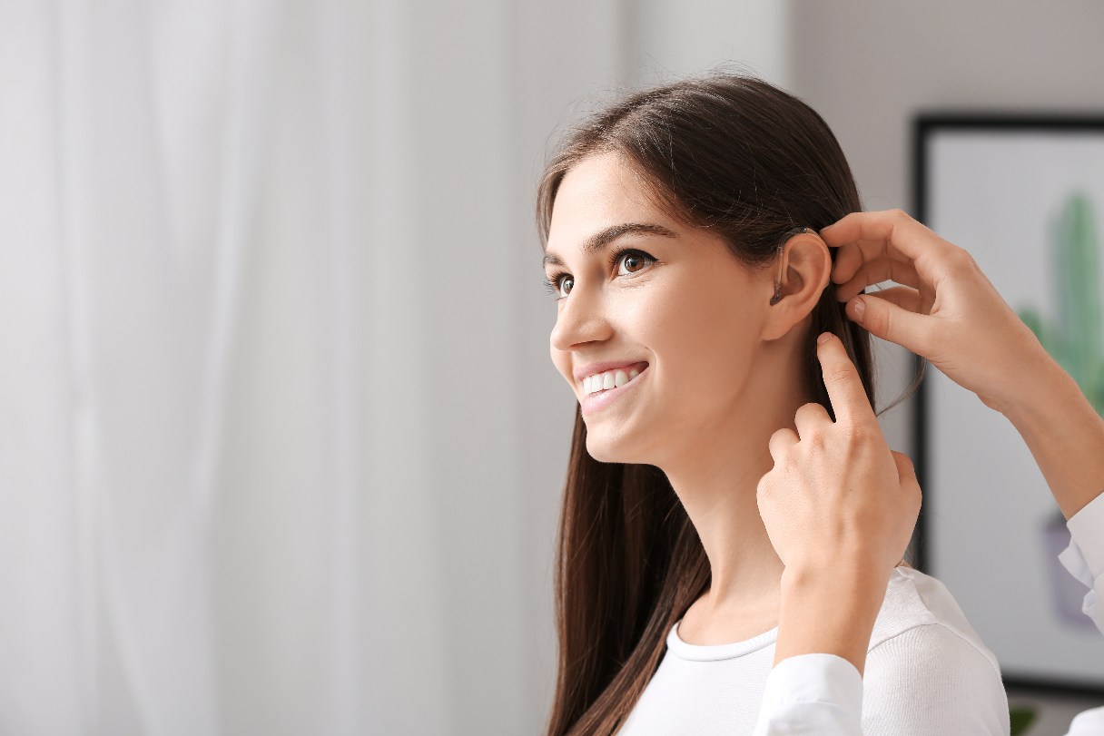 Woman being fitted with hearing aid