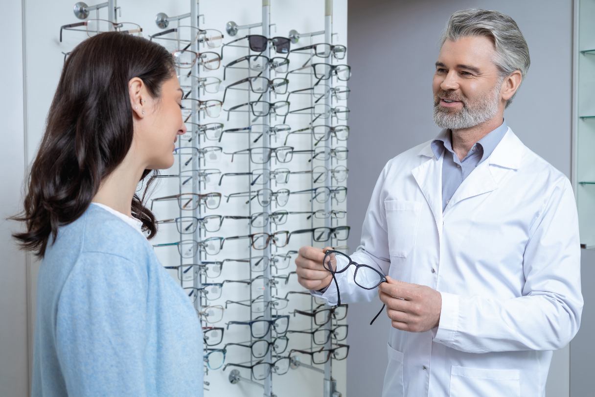Optometrist speaking with patient