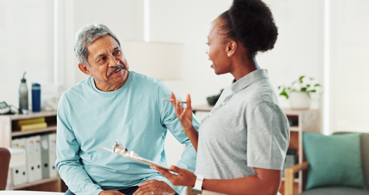 Medical professional speaking with patient