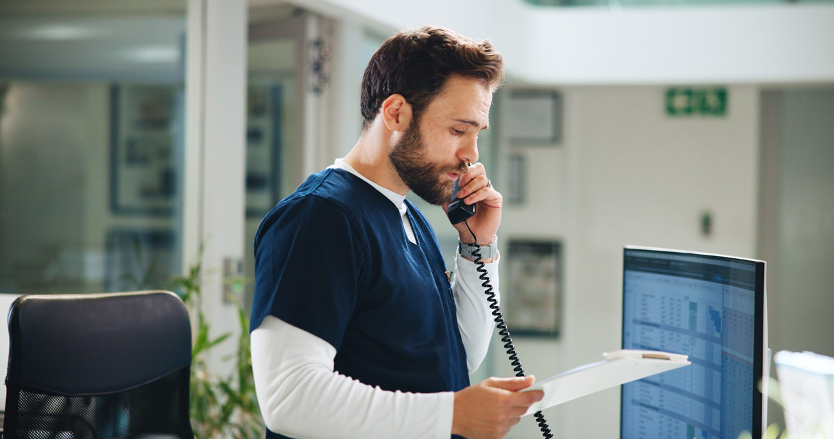 Health professional speaking on phone