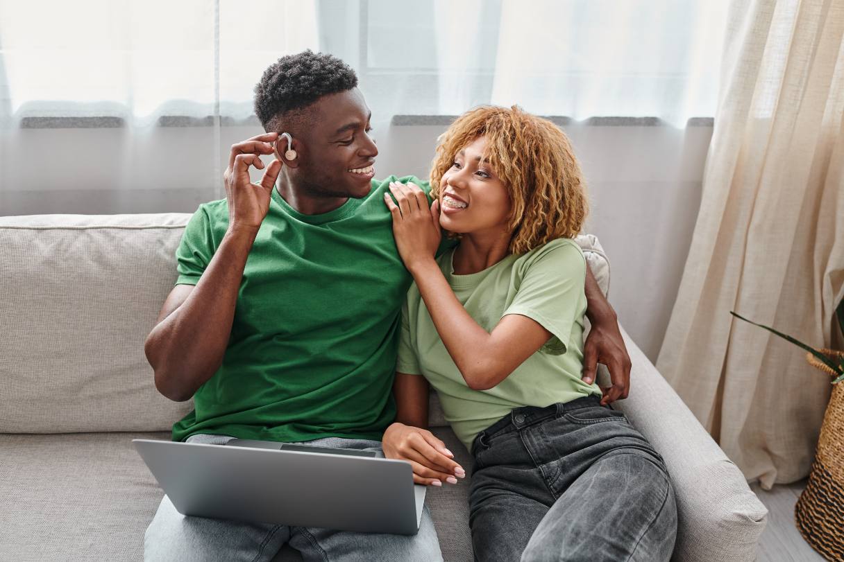 Man and woman working on laptop