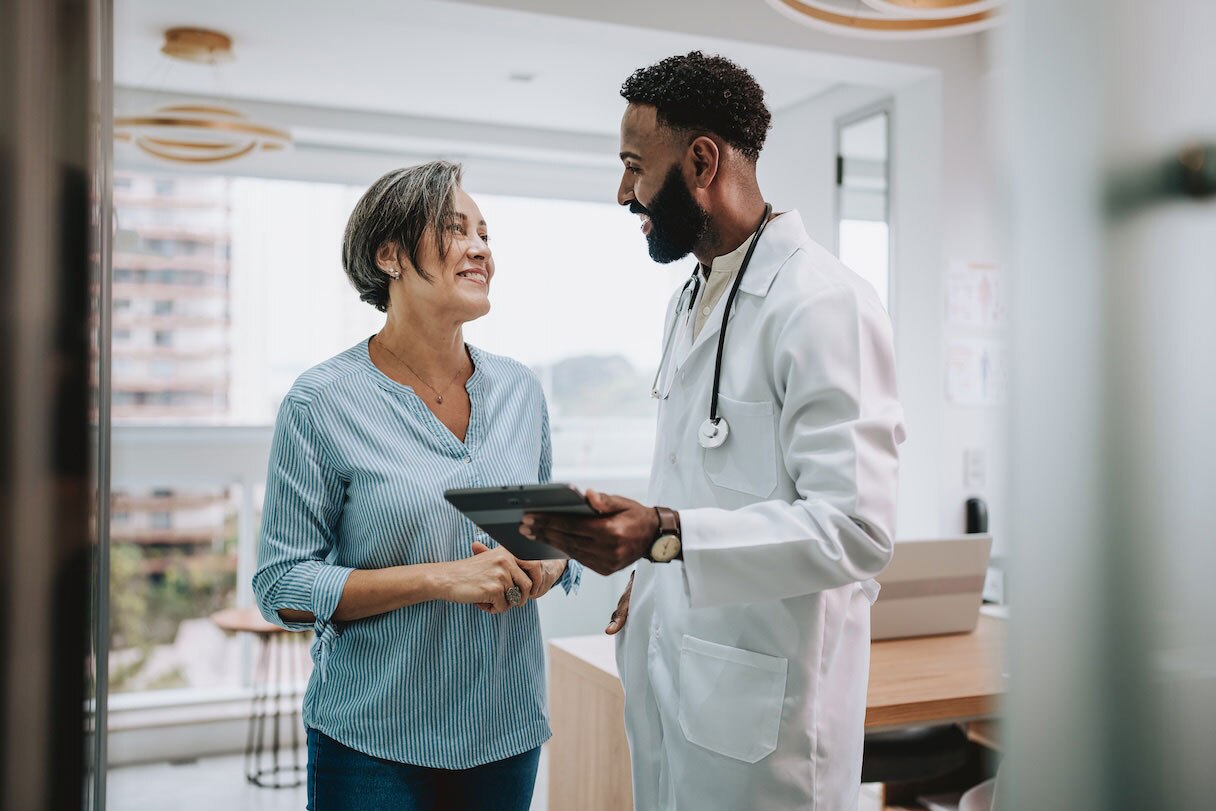 Doctor speaking with woman