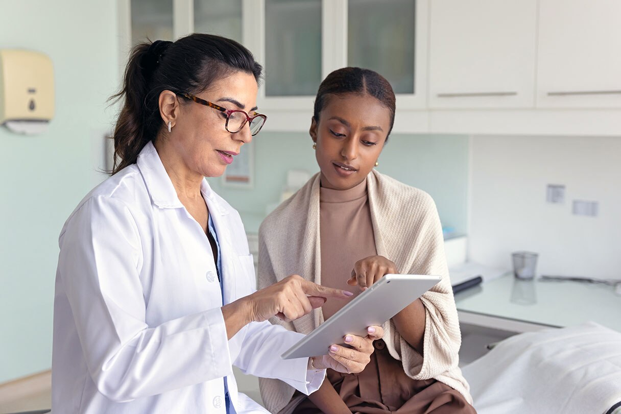 Provider showing patient a tablet device