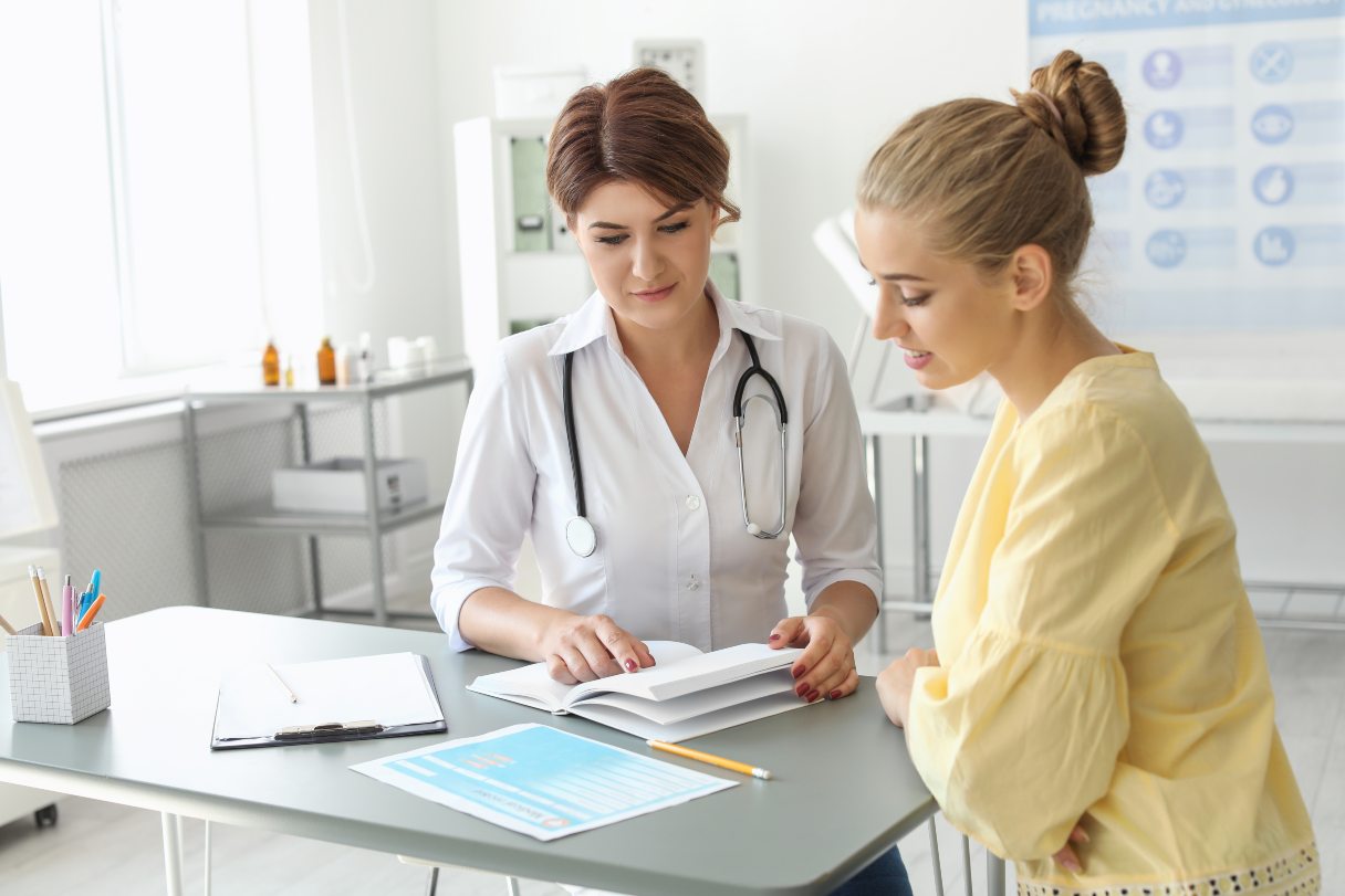 Woman speaking with doctor