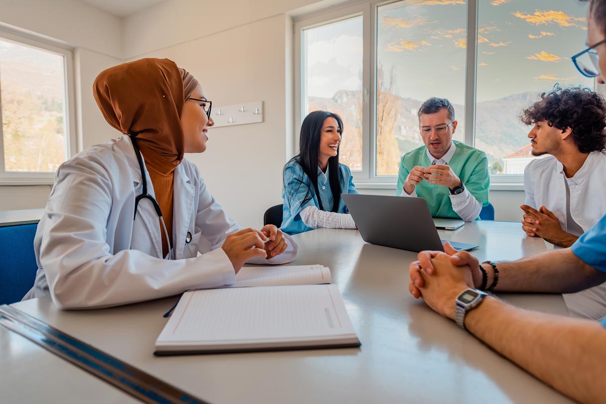 Medical professionals sitting at conference table