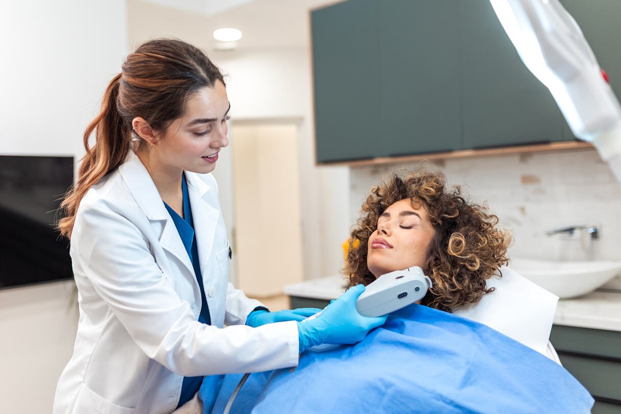 Cosmetic provider administering treatment on client