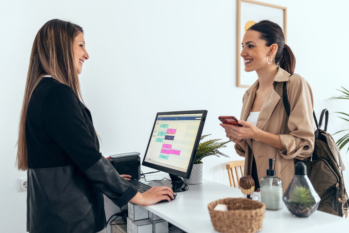 Receptionist speaking with client